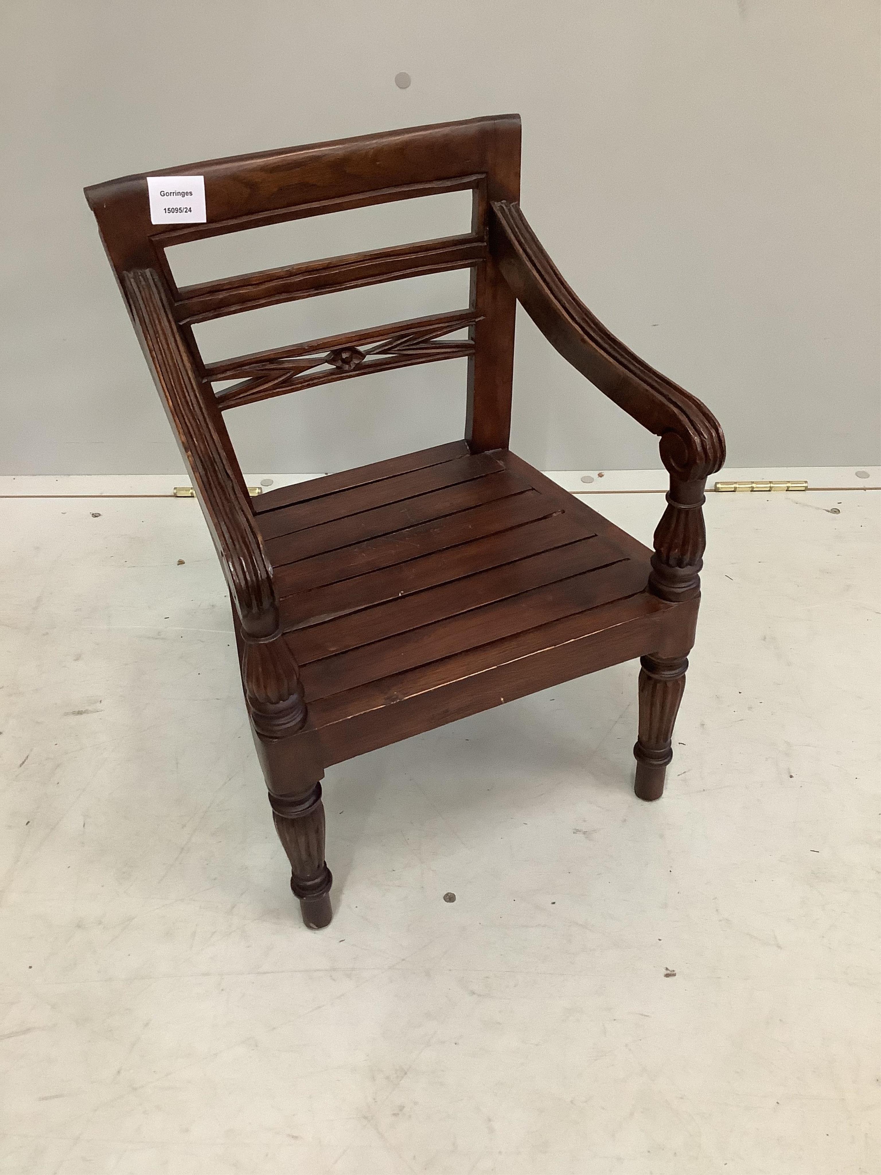 A reproduction hardwood child's chair, height 50cm. Condition - fair